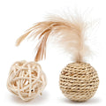 Set of two cat toys: a hollow rattan ball and a faux feather ball with bell, on a plain background.