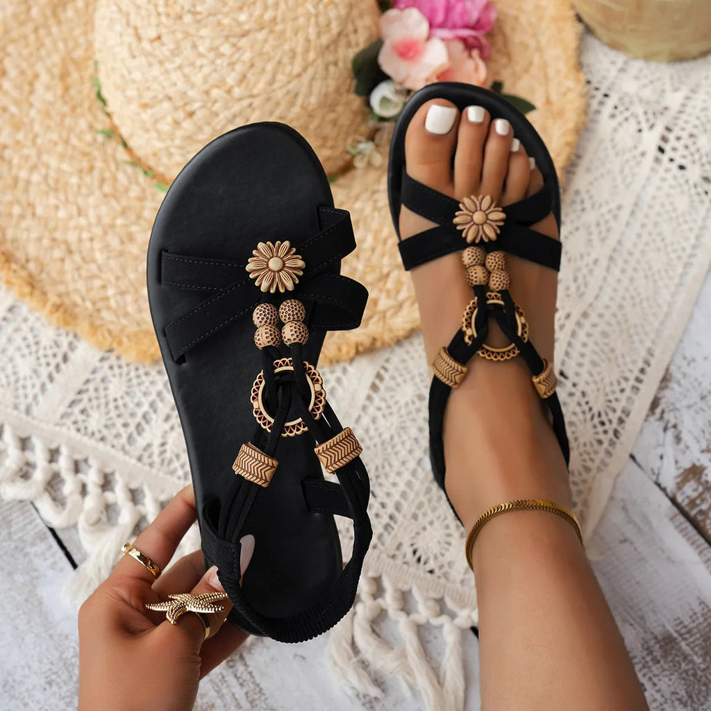 Women's black ethnic style flat sandals with beaded weave pattern, open toe design, and elastic band fastening