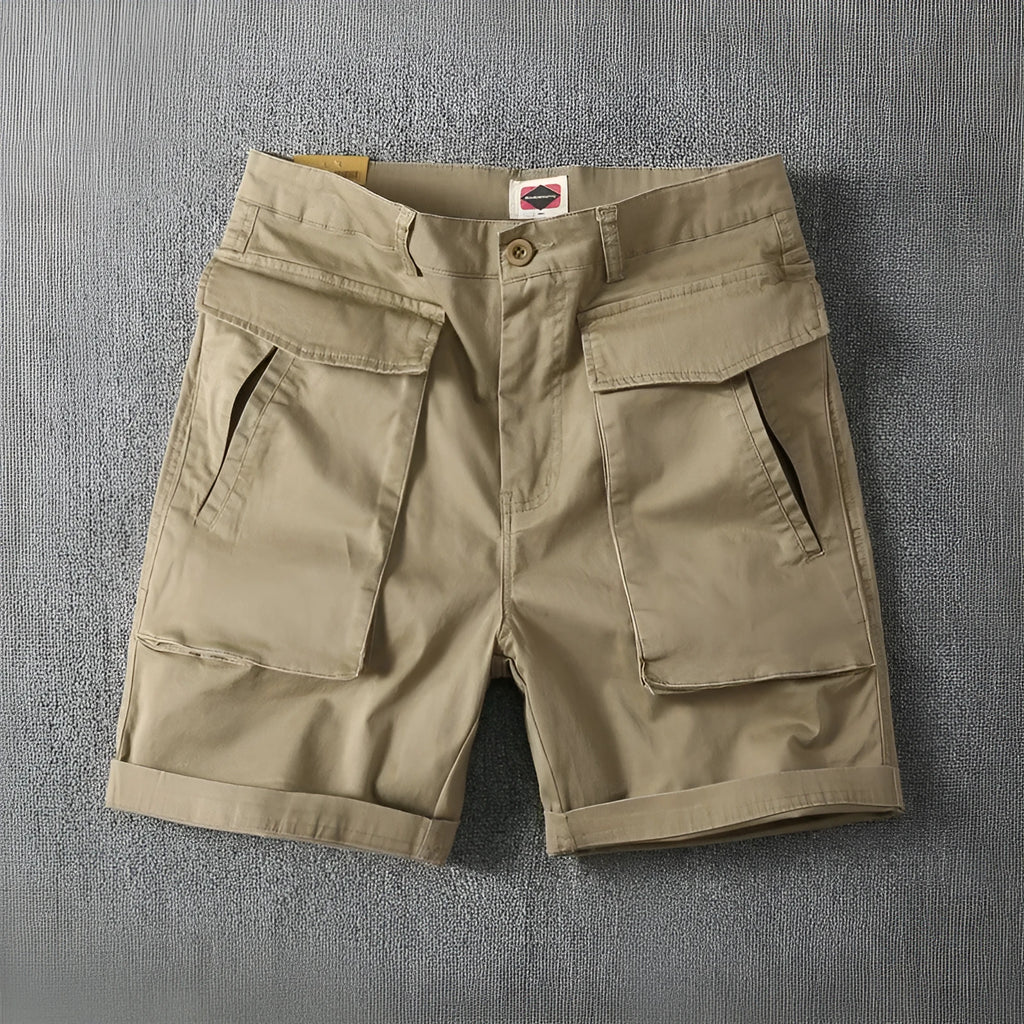 Men's army green cotton cargo shorts with multiple pockets and a straight leg design.