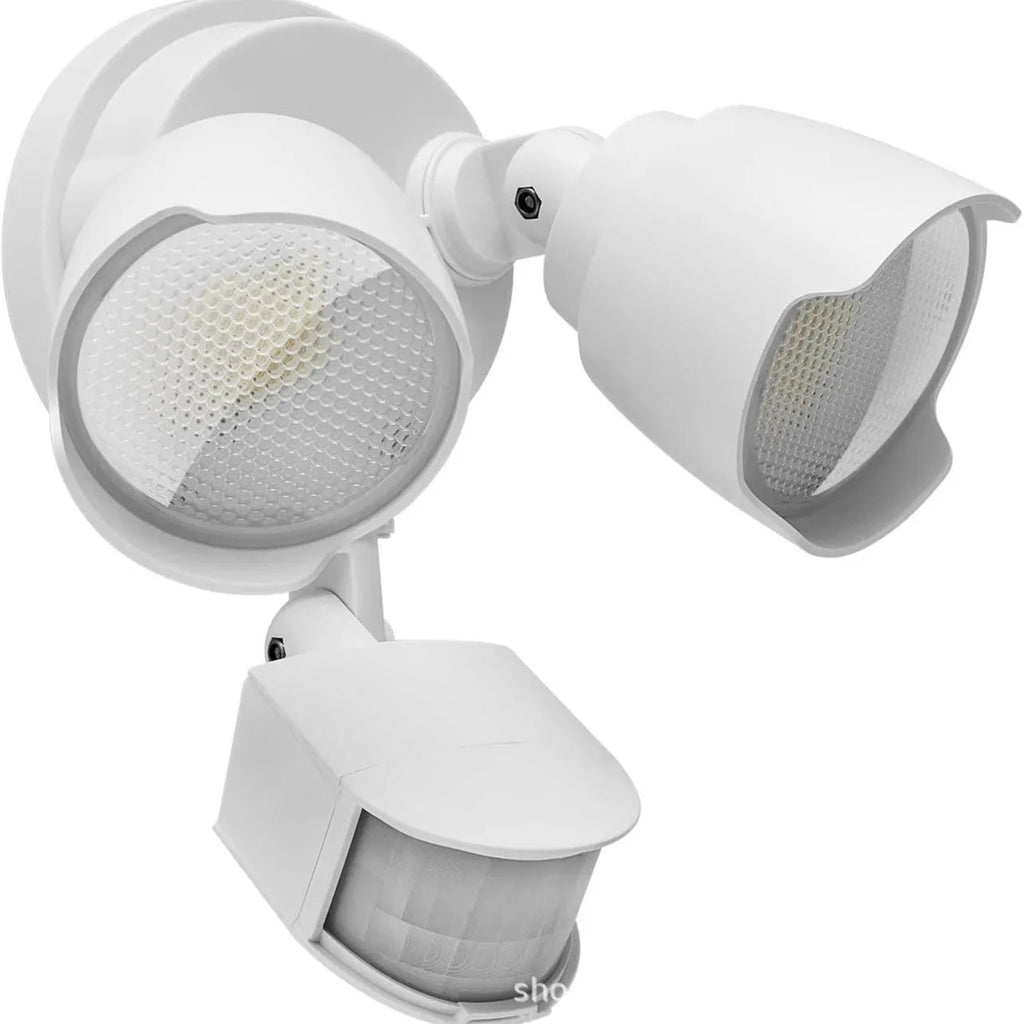 White or black LED human body induction security flood light with wall mounting bracket.