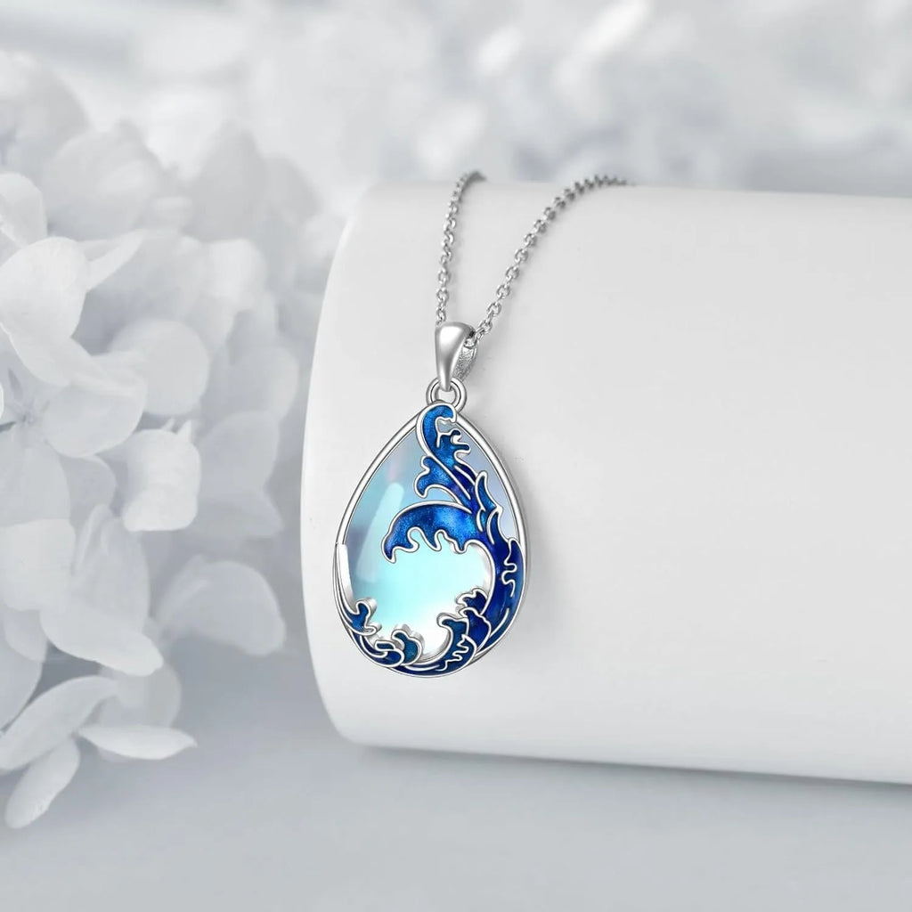 Blue alloy pendant necklace with heart design elements on included chain