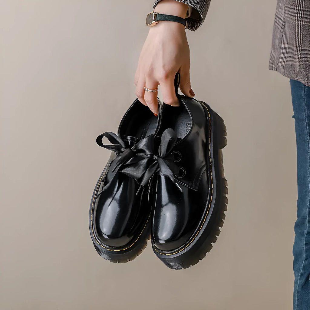 Women's thick-soled leather shoes in black with ribbon and cross strap details on superfine fibre upper