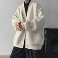 Women's loose knitted cardigan coat in black solid colour with long sleeves
