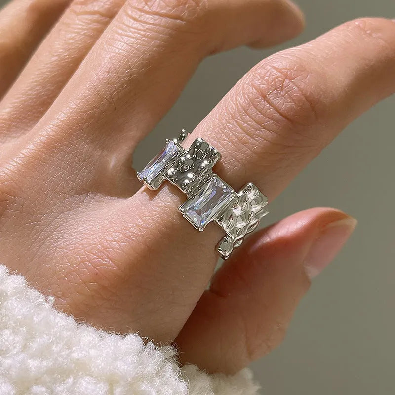 Silver open ring with cross zircon stones and geometric design