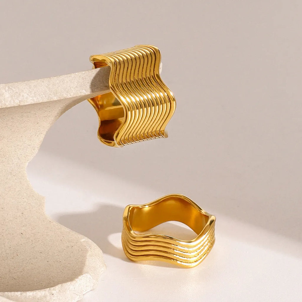Stainless steel geometric wave ring with wide surface design