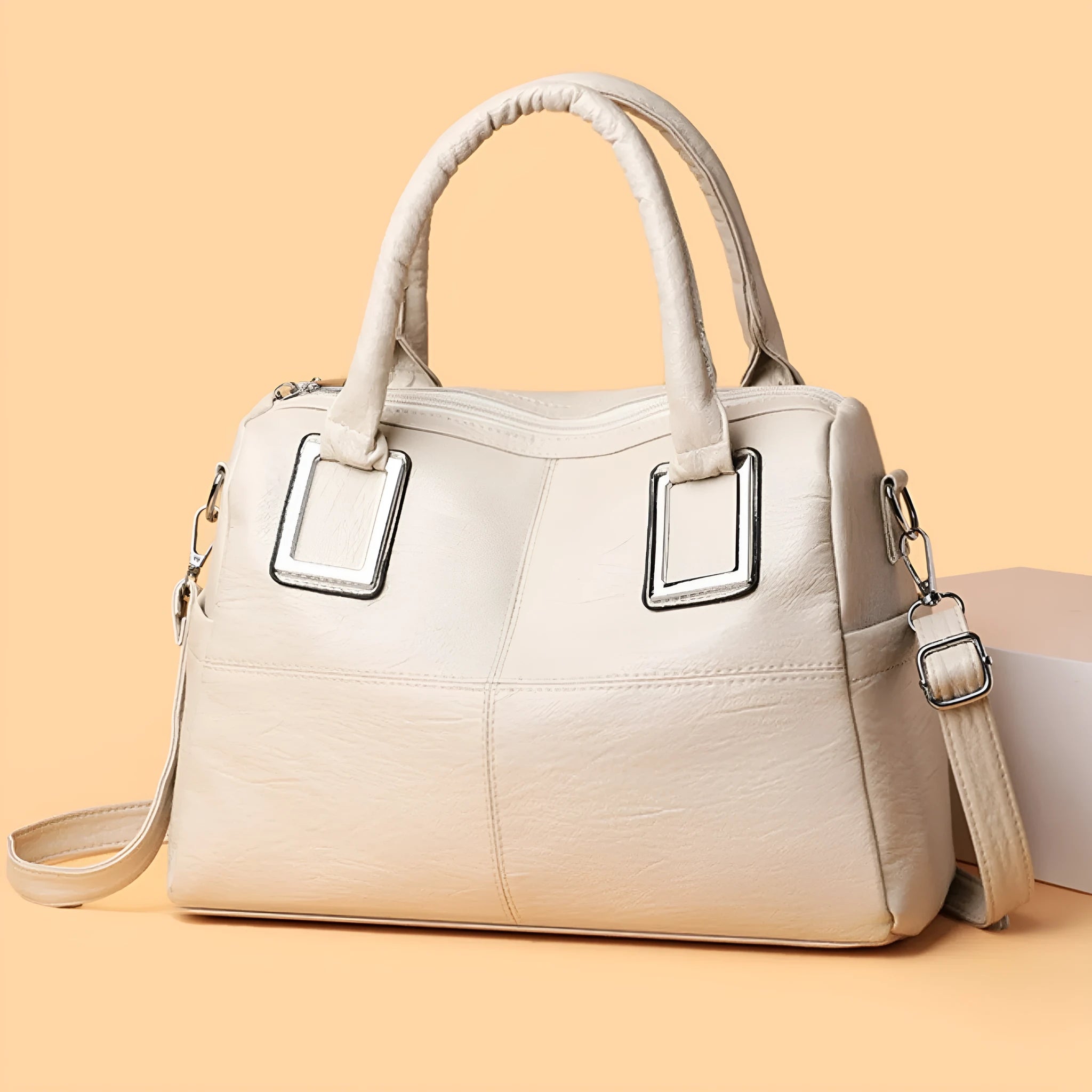 Women's large capacity horizontal square shoulder bag in wear-resistant material, shown in a neutral colour.
