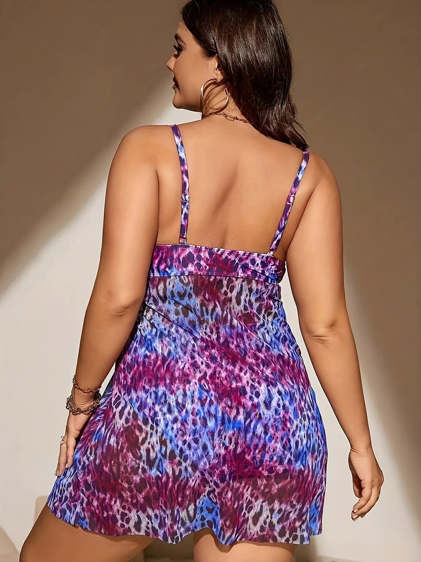 Plus size women's split skirt bikini set in blue, showing sleeveless top and shorts.