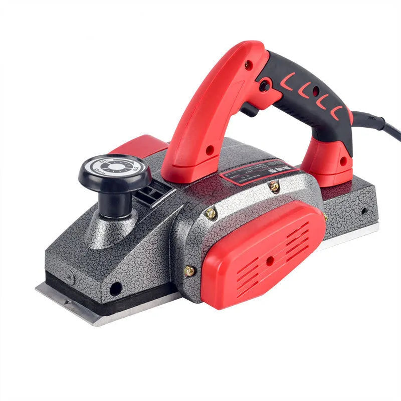 Red aluminium shell electric wood planer with 82mm cutting width on workbench