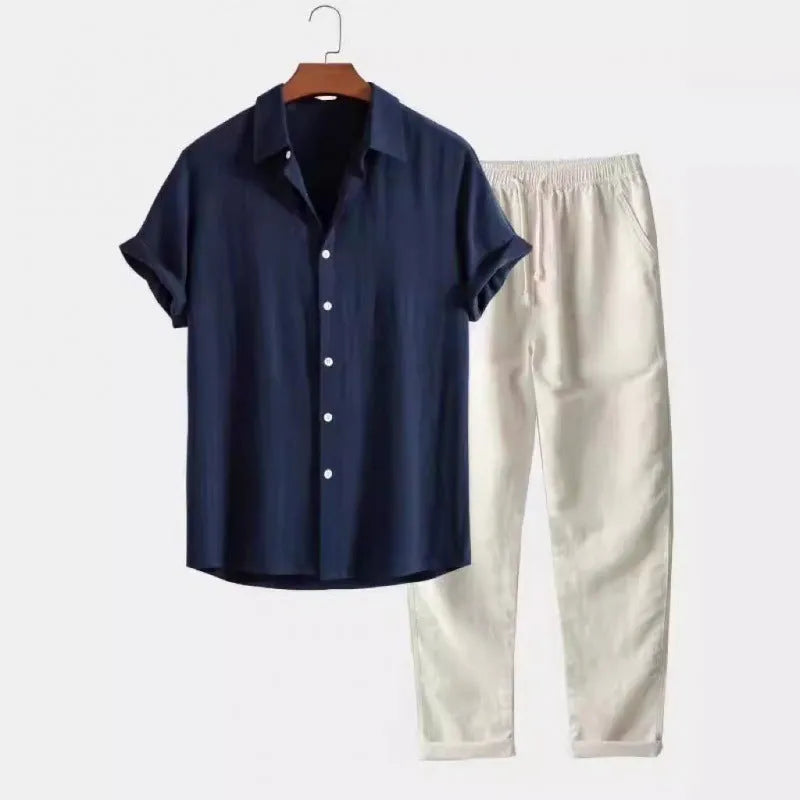 Man wearing a light blue loose-fit short-sleeve shirt and matching trousers from the casual set