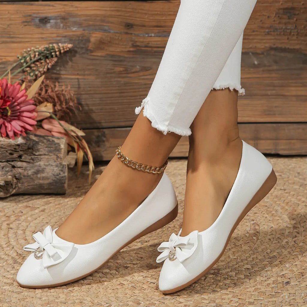 Women's beige flat casual slip-on loafers with a bow knot and shallow mouth design.