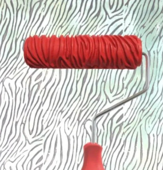 Red 7 inch texture paint embossing roller with patterned rubber sleeve for DIY wall painting.