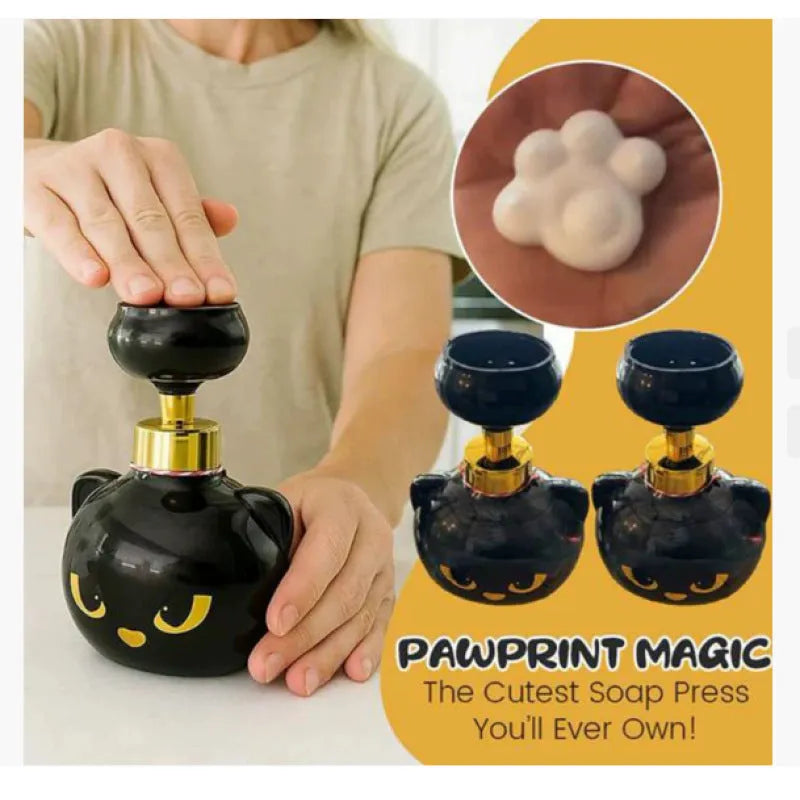 Black plastic cat-shaped cartoon foam soap dispenser pump bottle on a countertop.