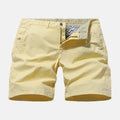Men's loose fit printed denim casual shorts in blue, shown on a hanger.