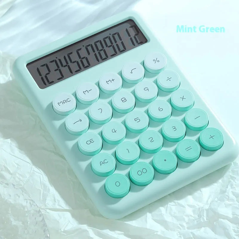 Vibrant gradient colour desktop calculator on a desk, shown in violet, pink, blue and green colour options.