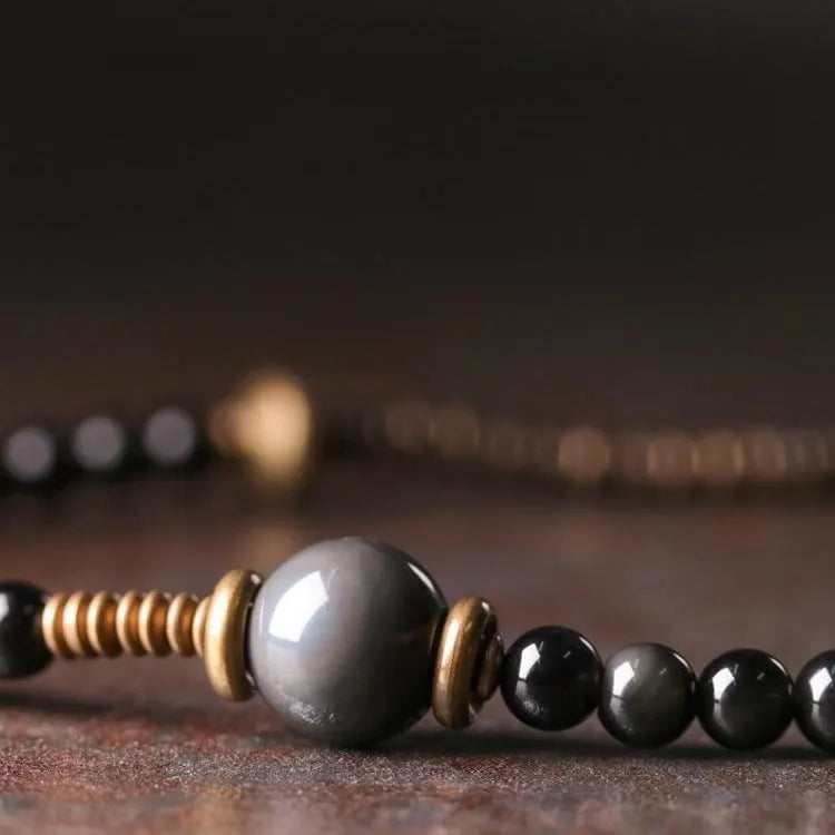 Black geometric layered bead bracelet with retro colourful design elements