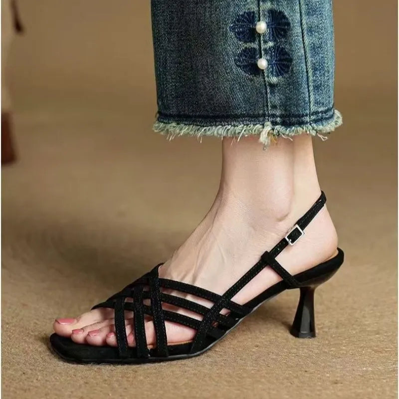 Retro soft leather-look women's sandals with thin cross straps, square toe, ankle buckle, and a mid-height heel