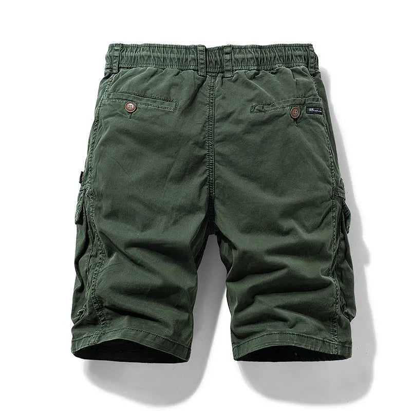 Men's army green cotton shorts with zipper fly and multiple pockets, shown in a Korean-style fit.
