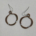 Bronze retro hollow round geometric bohemian earrings for women on light background