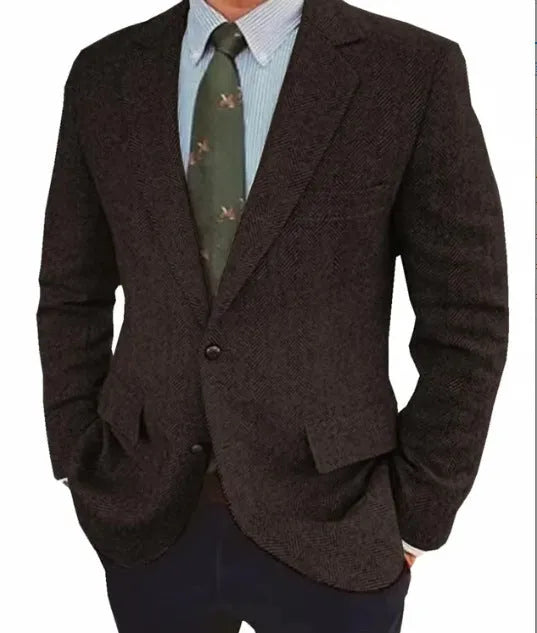Men's brown herringbone pattern retro suit jacket with long sleeves on a hanger.