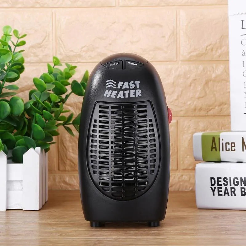 Black compact ceramic electric heater with digital display and a rotating three-prong plug on a white background.
