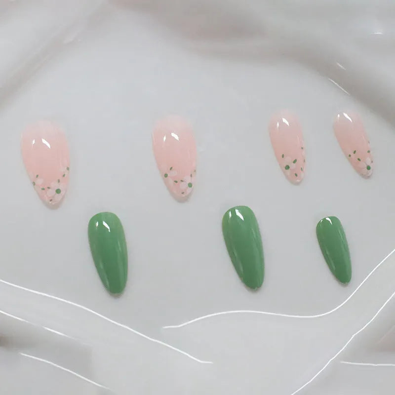 Long almond artificial nails with white little flower pattern and jelly glue rub in CW680 colour classification