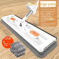 Large flat mop with stainless steel handle and blue mop cloth on hard floor
