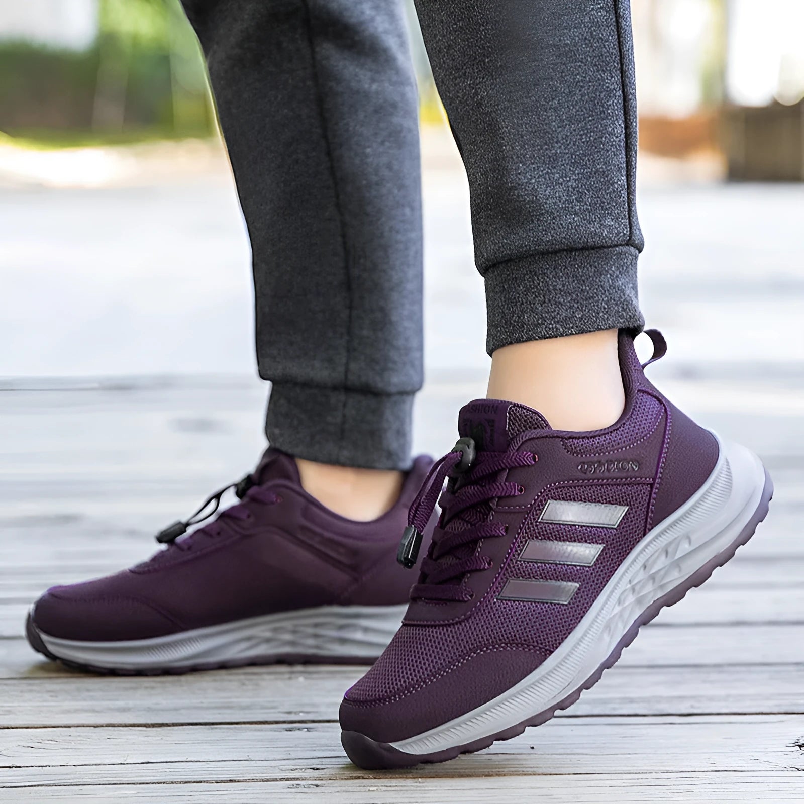 Breathable mesh casual shoes with elastic band closure in black, dark grey, purple and purplish red.