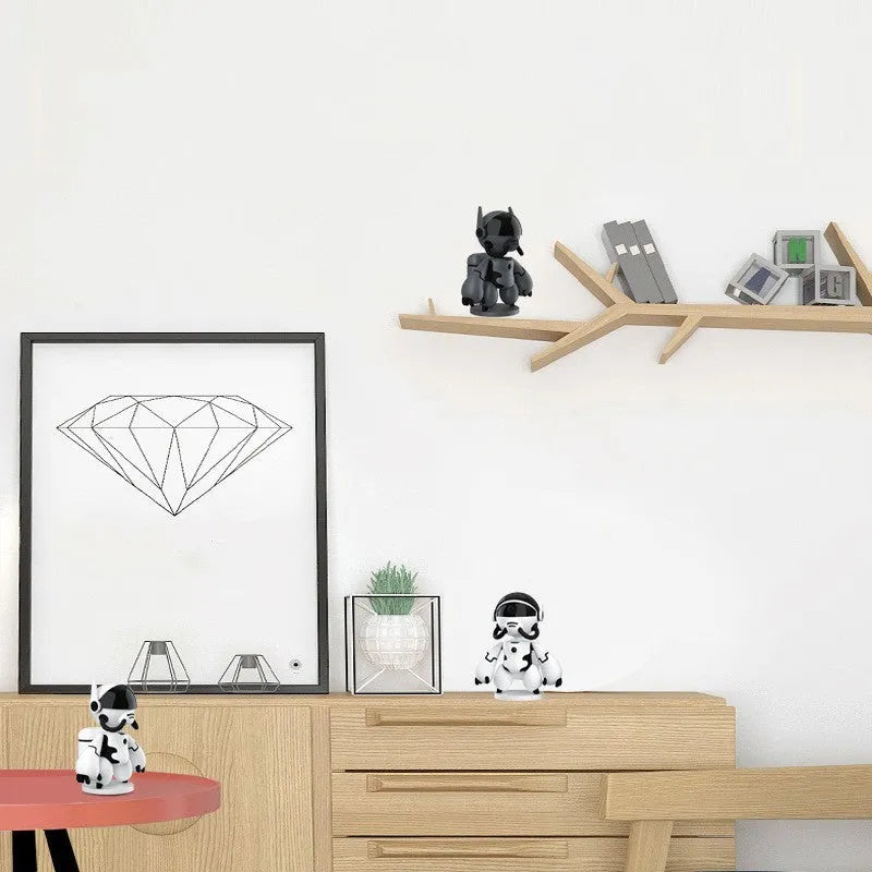 White or black Space Robot home security camera on a detachable base with anti-slip pads.
