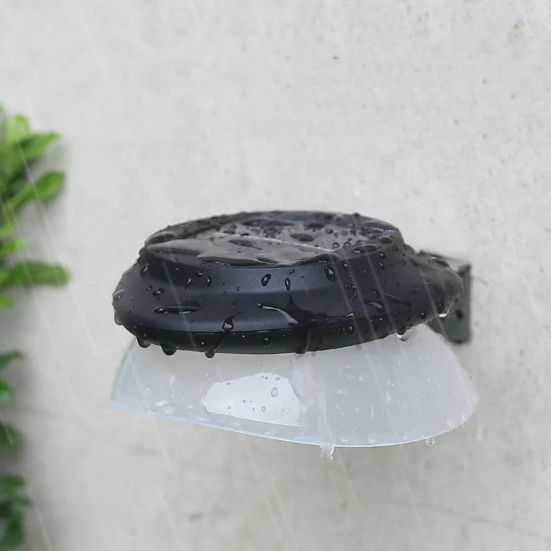 Solar-powered outdoor fence wall lamp with Southeast Asian design in garden setting