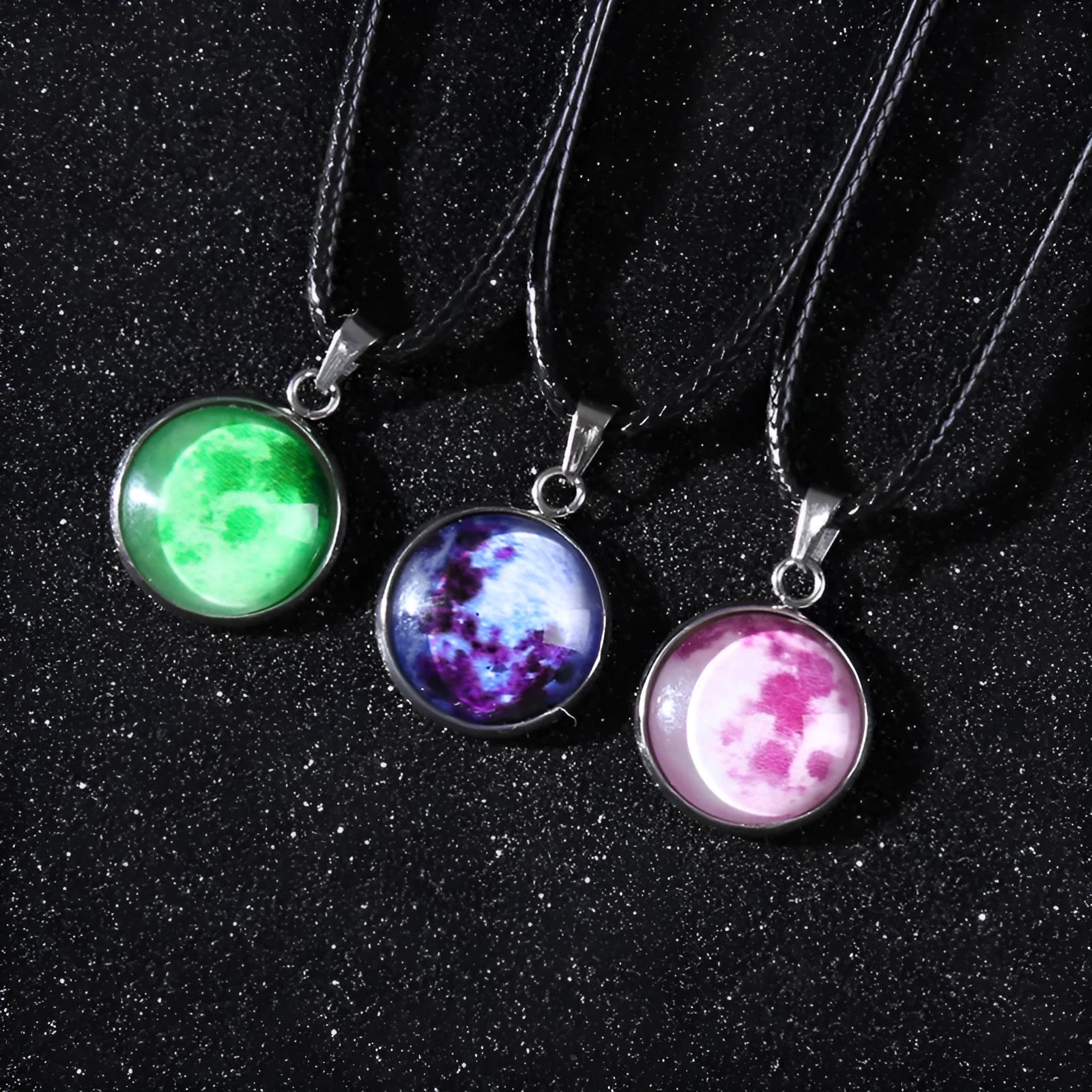 Luminous alloy necklace with a glass pendant depicting a Christmas moon night sky, showing the extension chain.