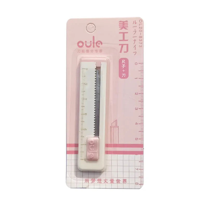 Small plastic art knife in blue, shown next to a ruler showing its 7.2 cm length.