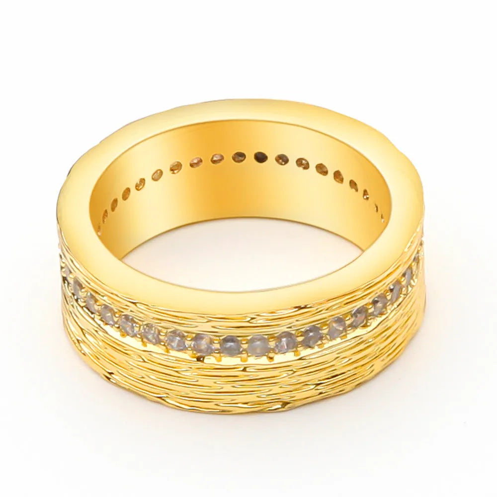 Gold geometric zircon ring in electroplated copper showing angular design details