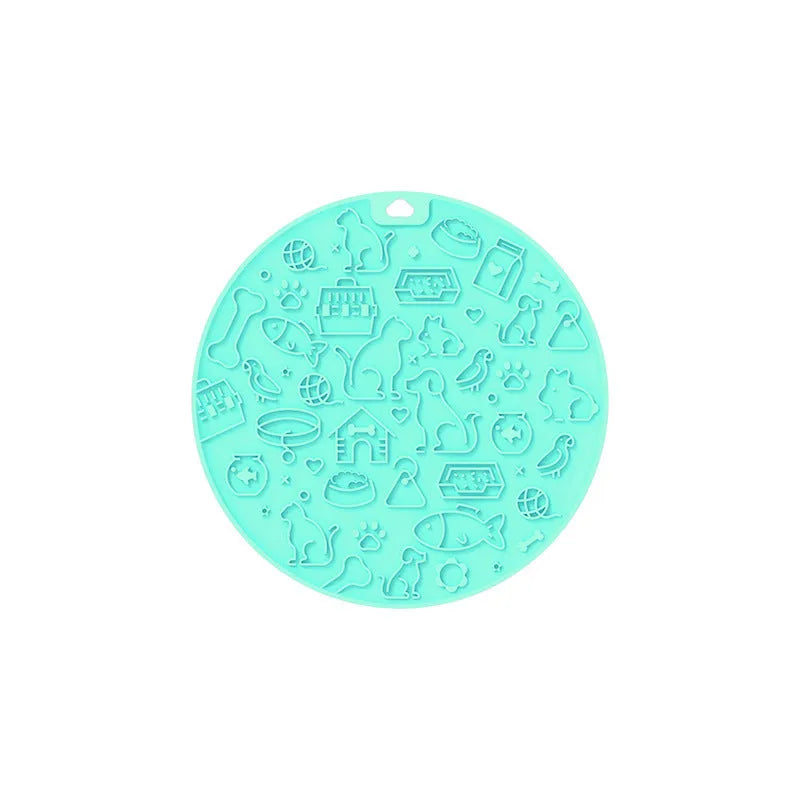 Round silicone pet licking mat with suction cup base in blue colour on kitchen floor