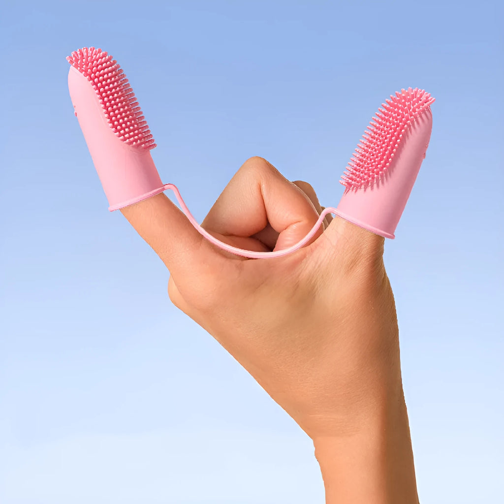 TPR finger cover for pet tooth cleaning in pink, blue green, and yellow.