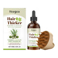 Rosemary castor oil hair care oil 100ml bottle with green label and black massage comb on side
