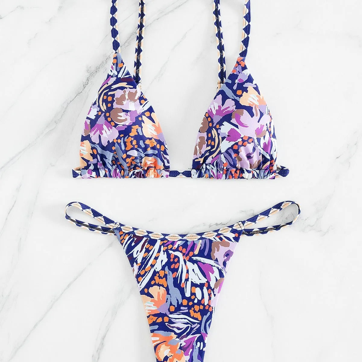 Women's floral print polyester triangle bikini swimsuit with briefs-style bottom.