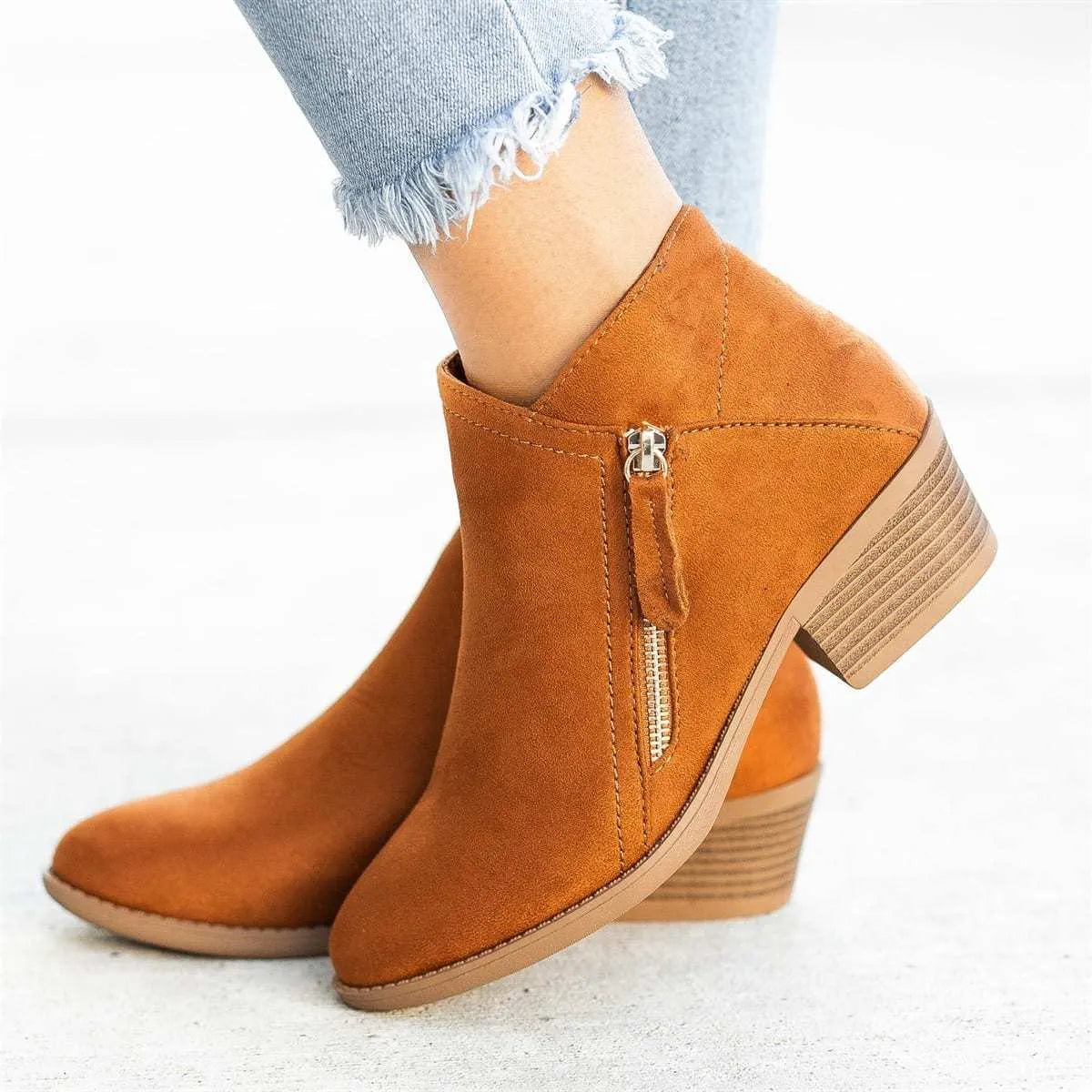 Women's suede Dr. Martens ankle boots with a side zip and chunky heel in beige colour
