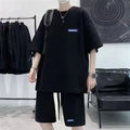 Waffle-textured leisure sports suit in blue, showing short sleeve top and matching shorts.