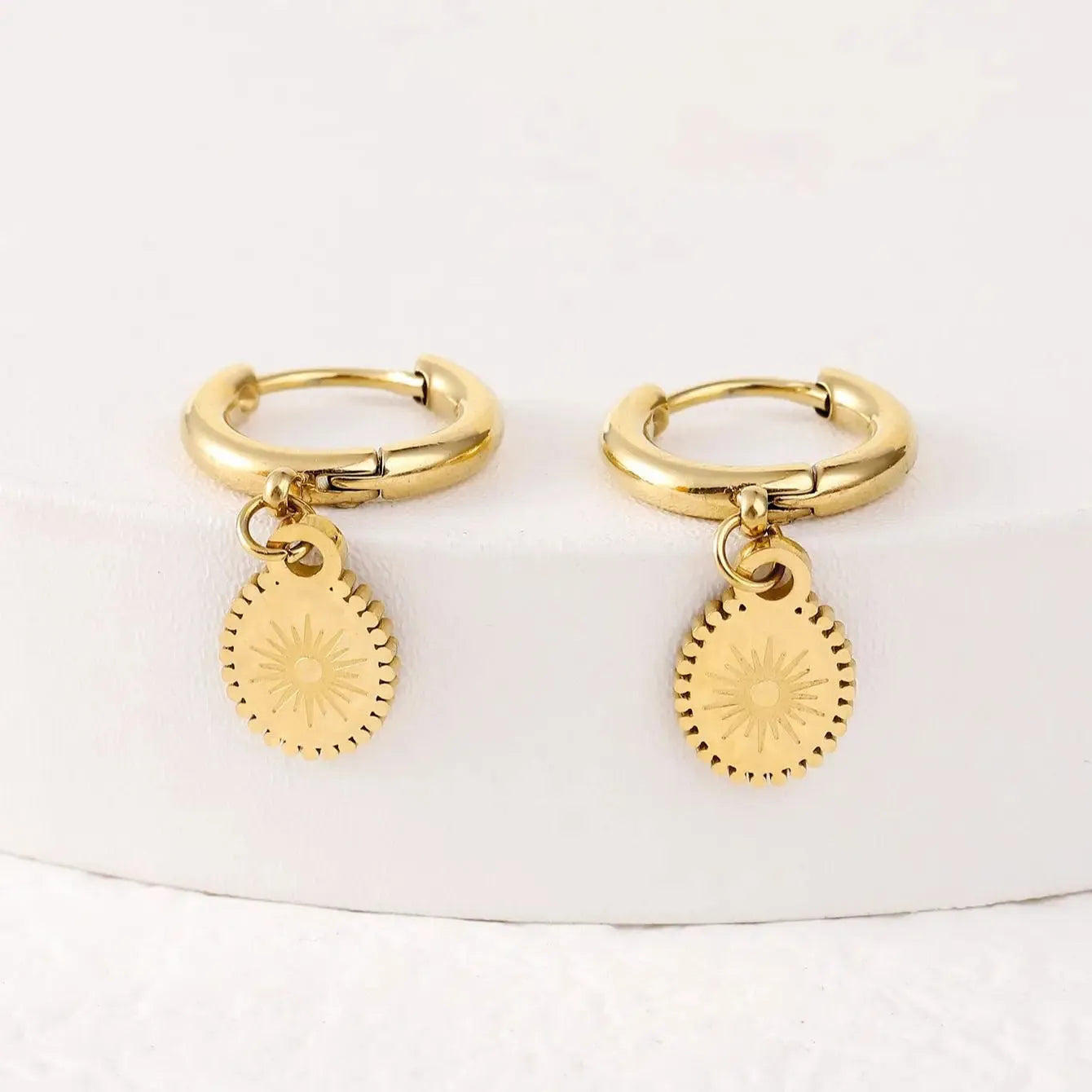 Geometric stainless steel earrings with elliptical design and ear button backs in colour XY-EH005