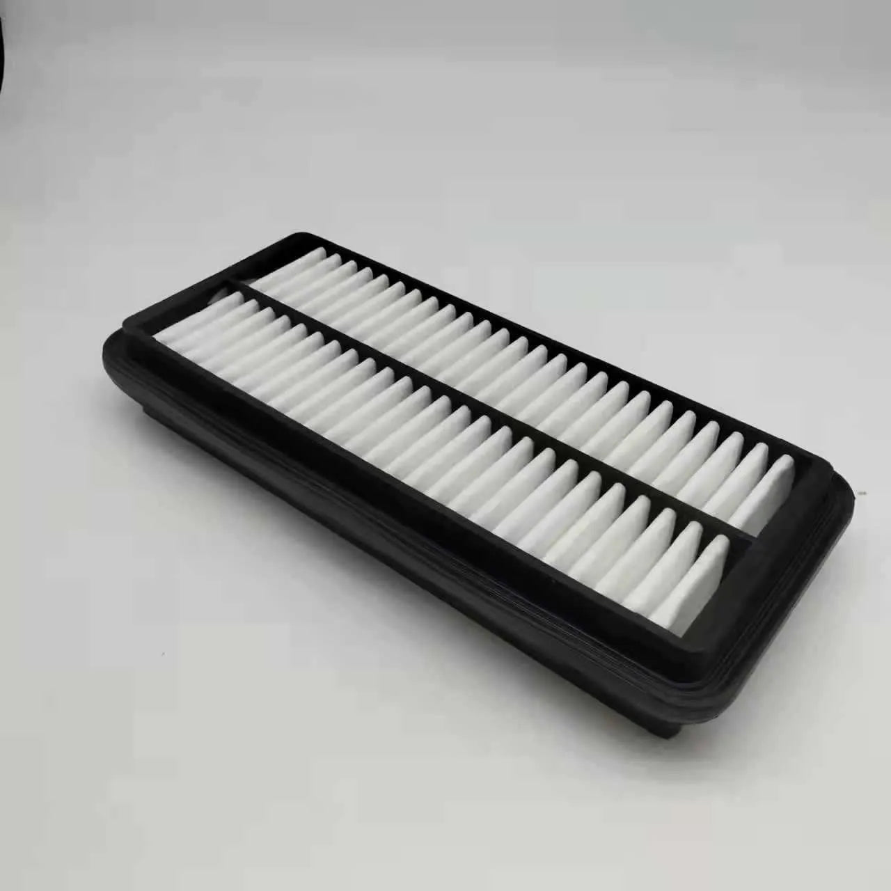 Black rectangular car air filter for Modern vehicles, dimensions 256mm by 113mm by 40mm.