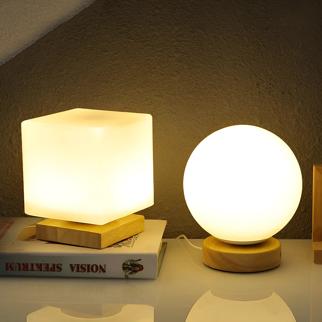 Nordic style solid wood USB table lamp in white, showing touch dimming and one of the geometric shape options.