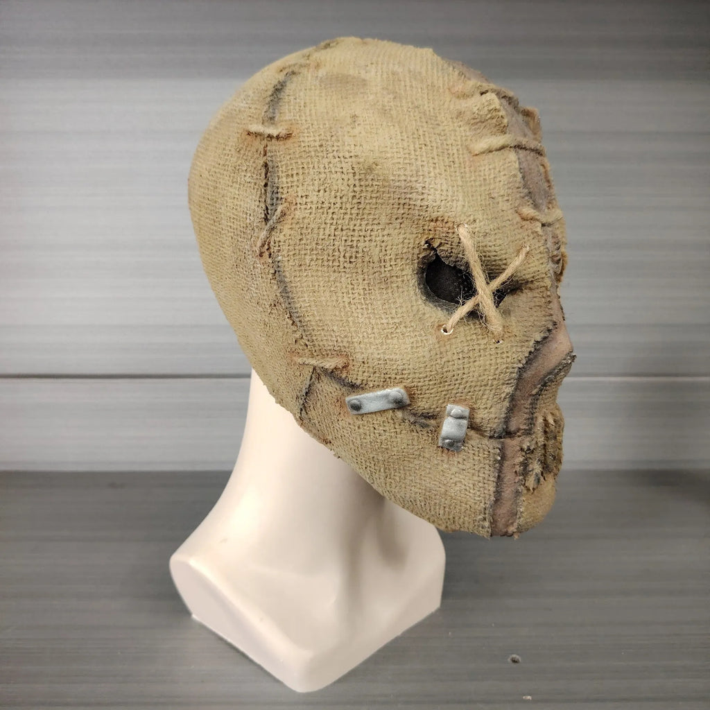 Latex Halloween horror mask with scar skull design, shown as a full head cover.