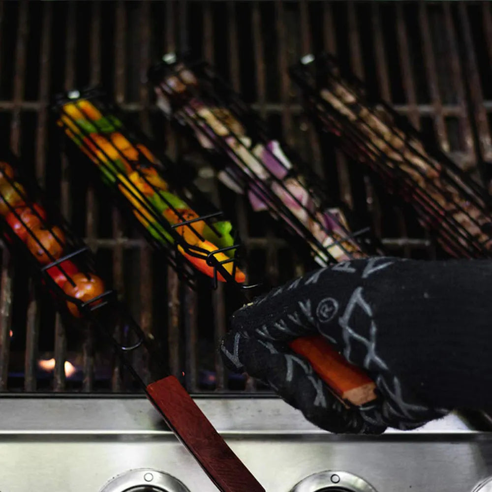 Burlywood barbecue grill mesh basket with rotary lid and long wood handle on a grill