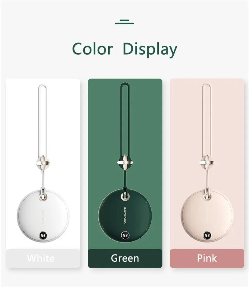 Green hand warmer power bank with digital display showing battery percentage, next to a charging cable.