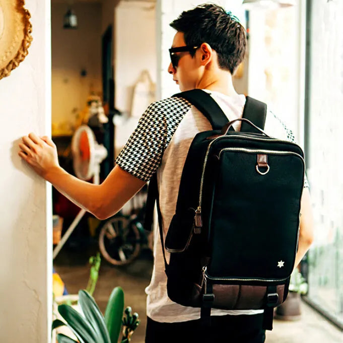 Men's modern Korean-style backpack in Oxford cloth, shown in Army Green colour, displaying its large capacity and adjustable straps.