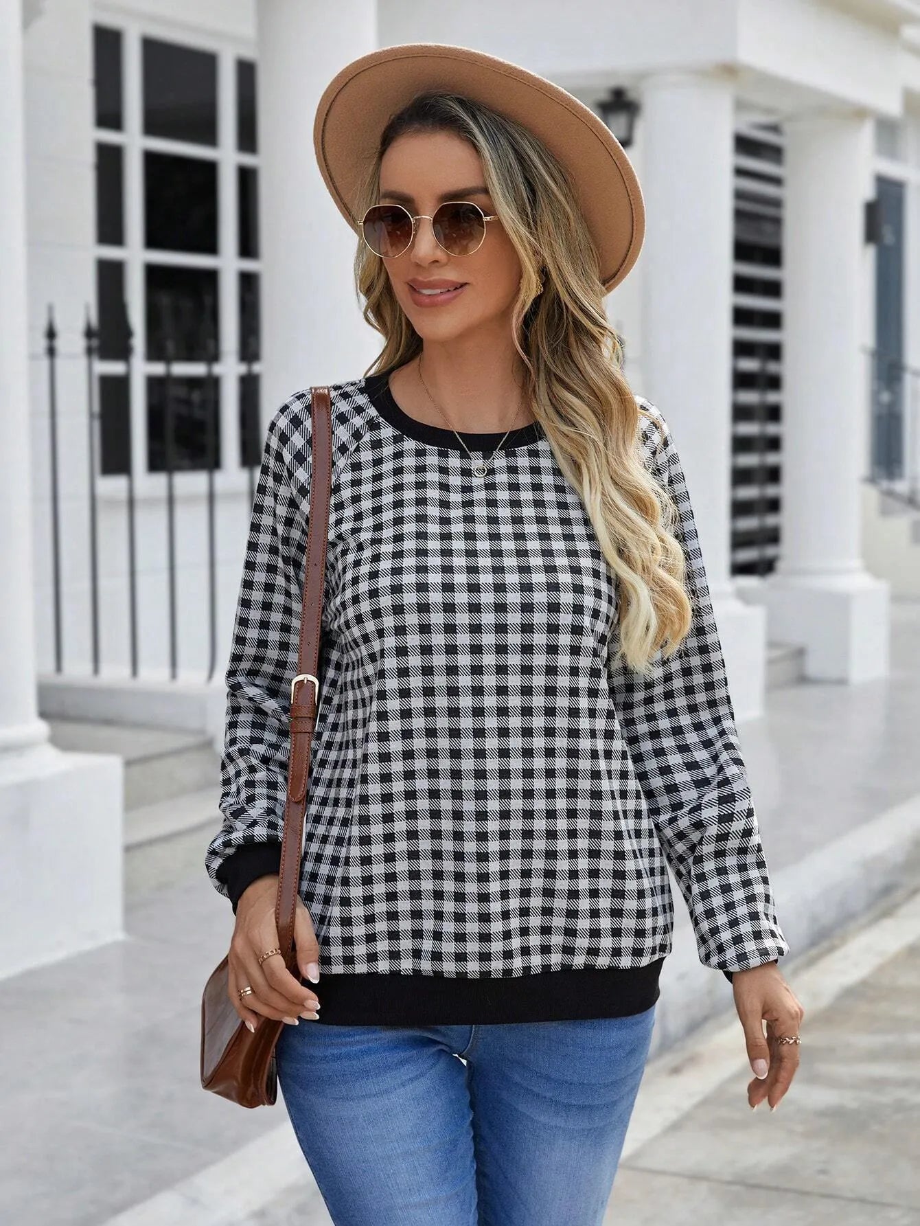 Black long sleeve pullover sweater with a printed Japanese plaid pattern