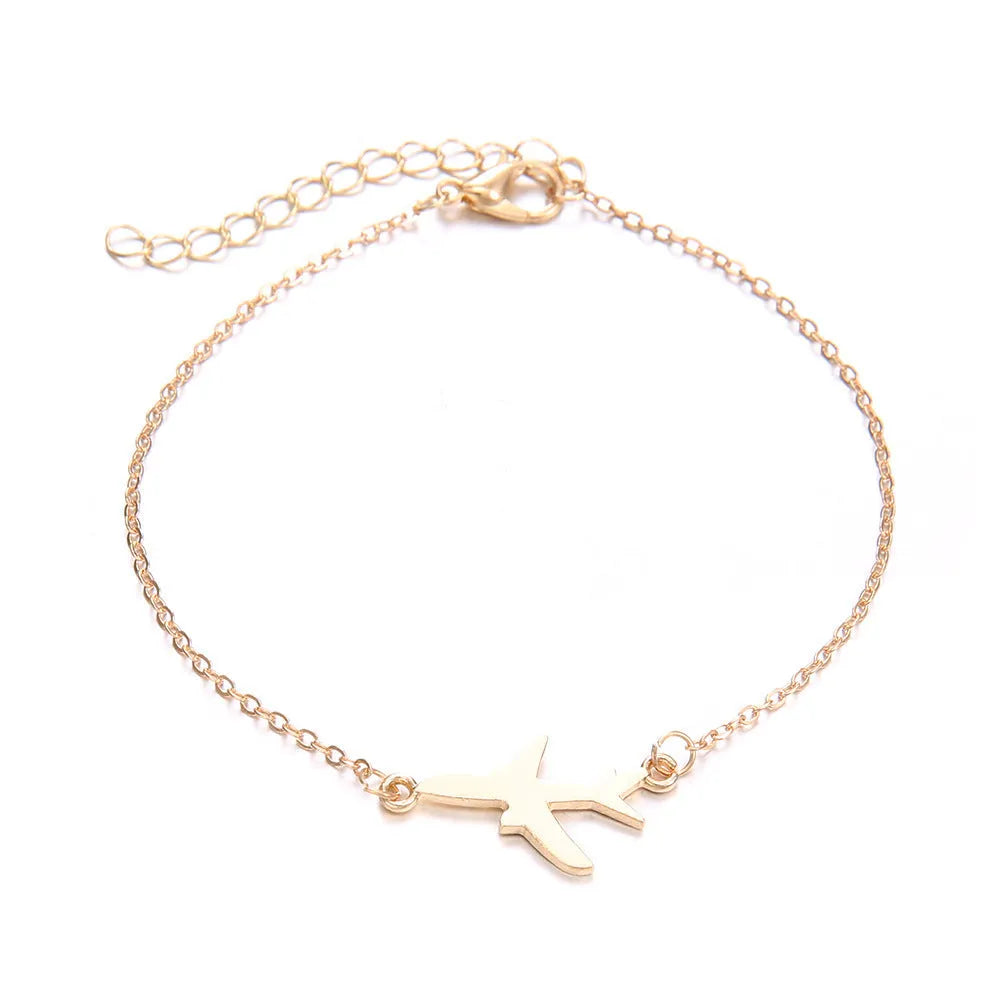 Three matching women's charm bracelets with heart-shaped aviation map designs in electroplated alloy