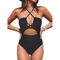 Women's solid colour cross backless one-piece swimsuit on a mannequin