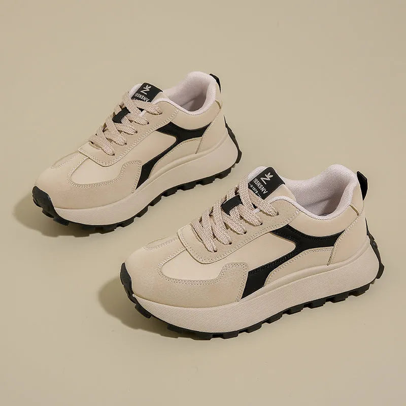 Women's solid colour platform sports shoes with lace-up front and flat rubber sole.
