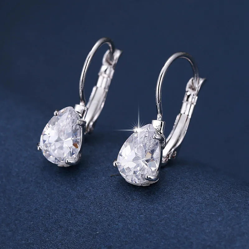 Women's drop-shaped simple metal fashion earrings in gold and platinum colour options.